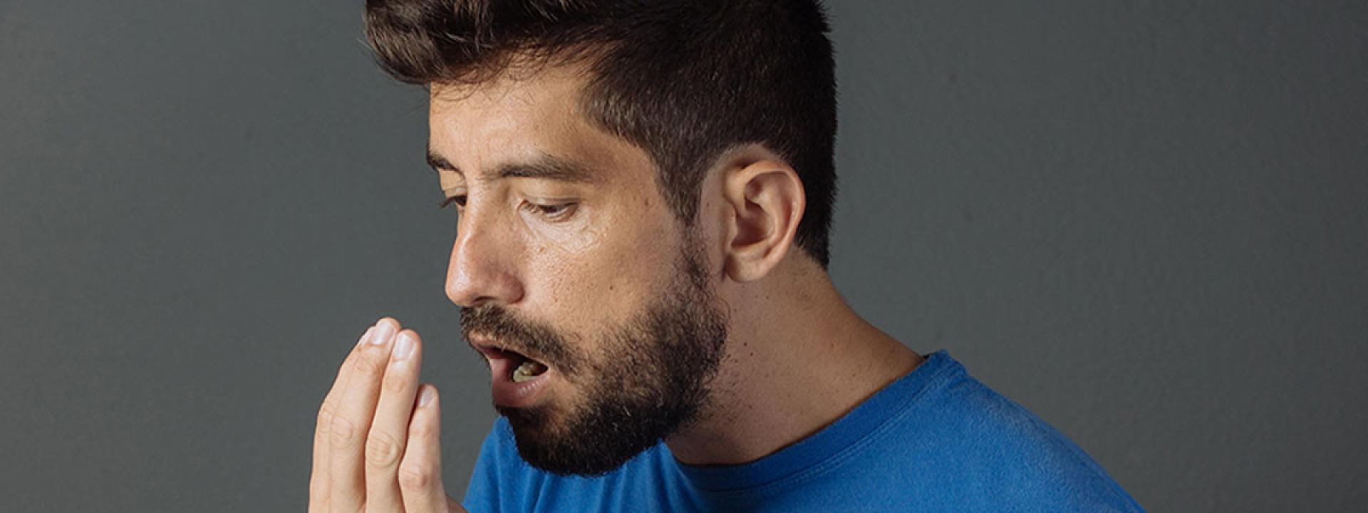 Person check his mouth smell Person check his mouth smell