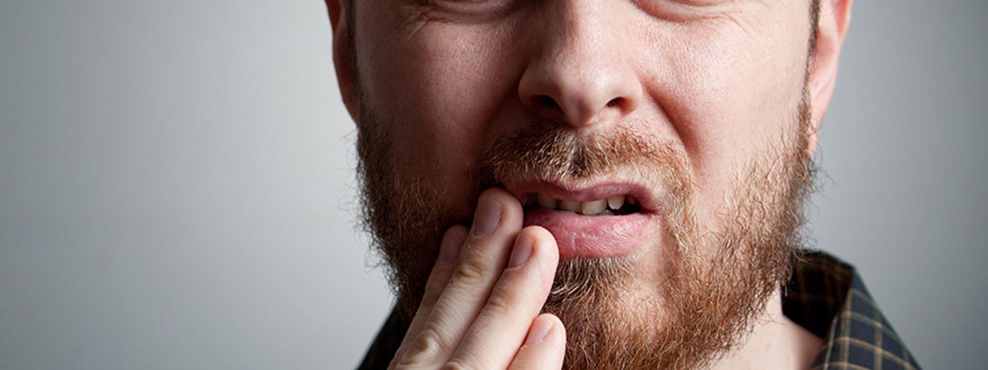 Man in tooth pain Man in tooth pain