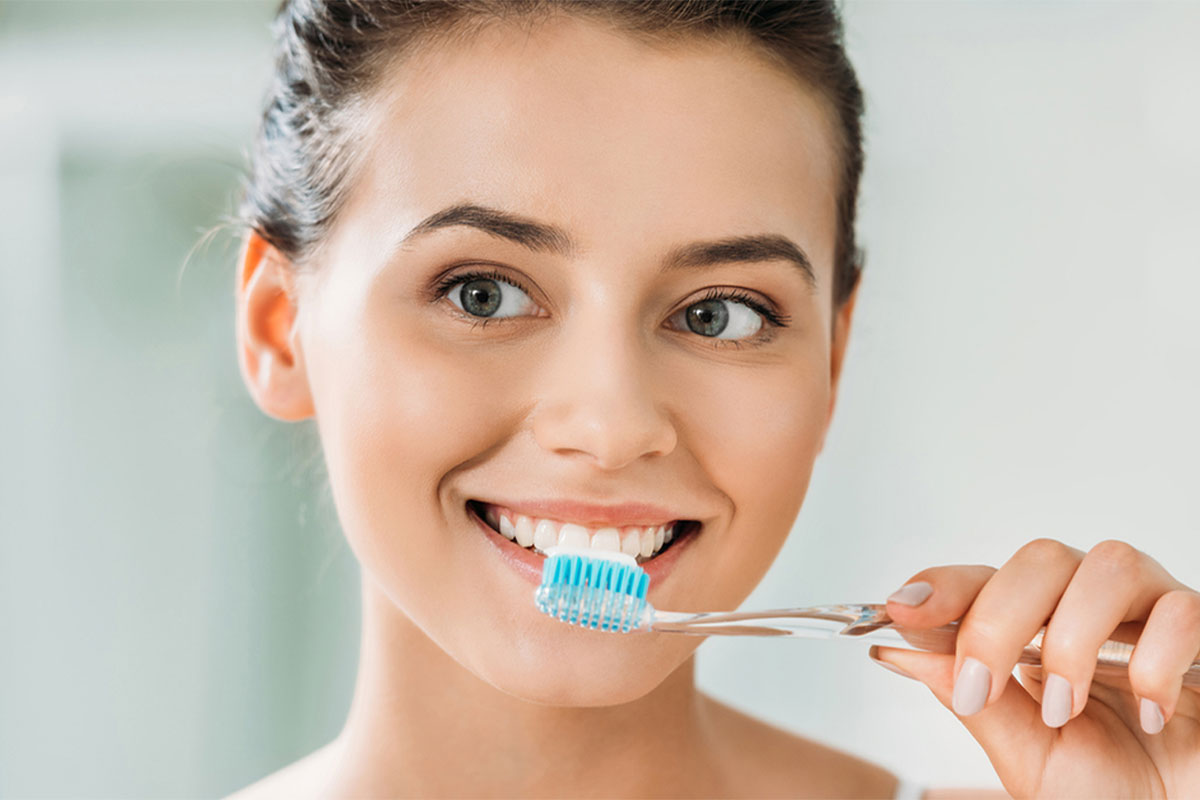 Woman brush her teeth