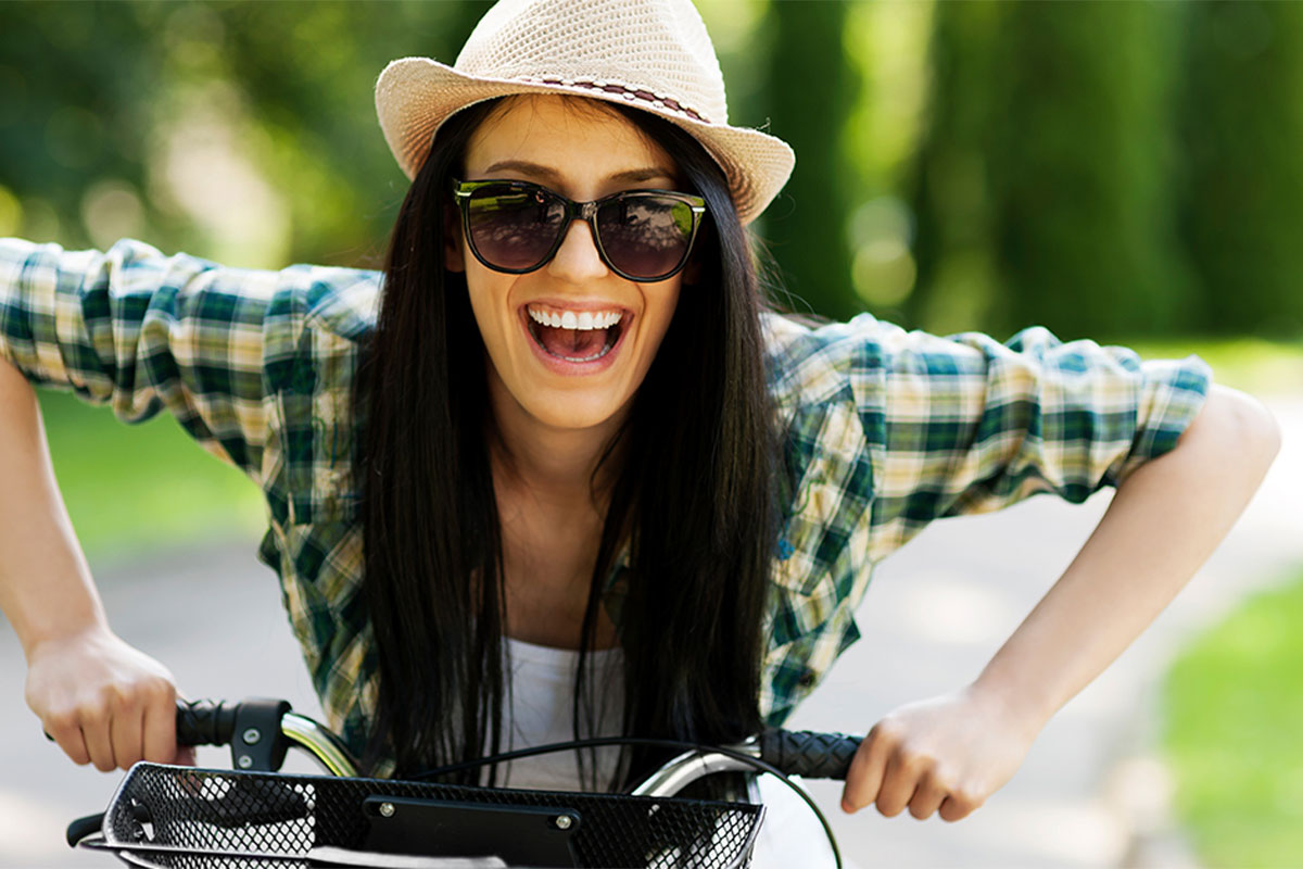 Beautiful woman riding the bicycle