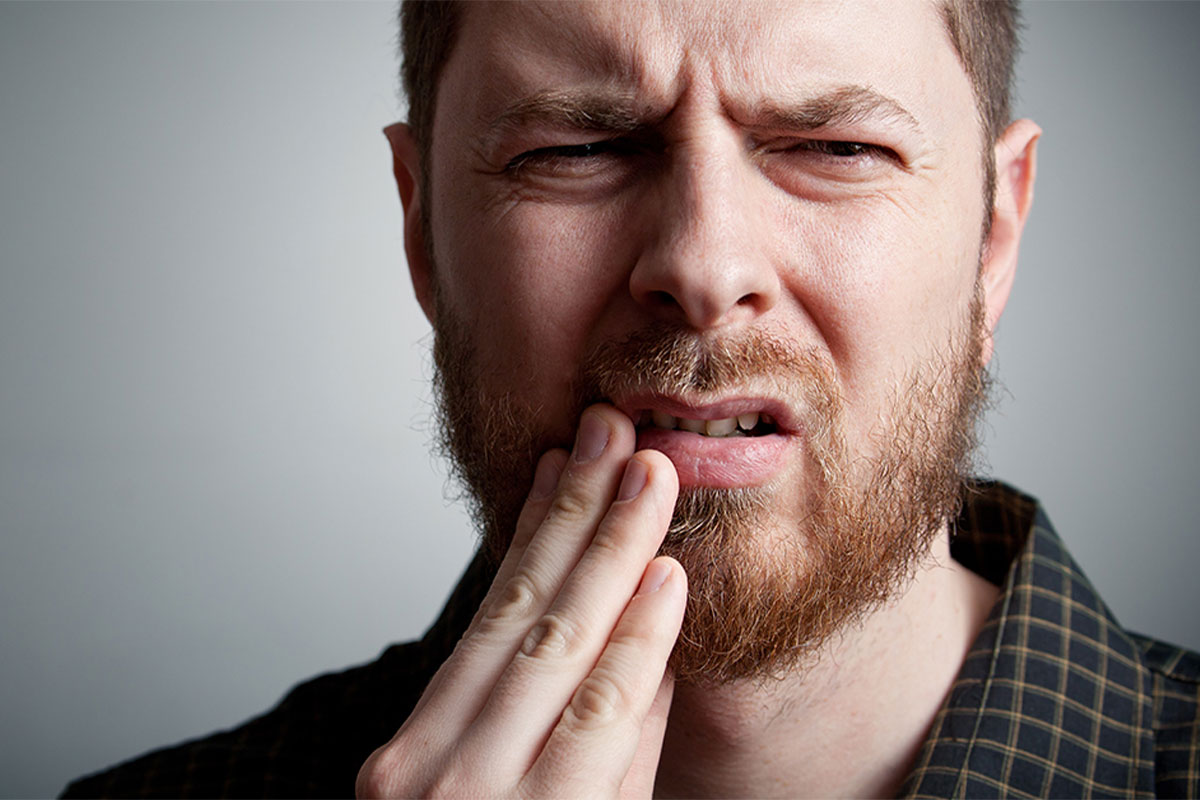 Man in tooth pain